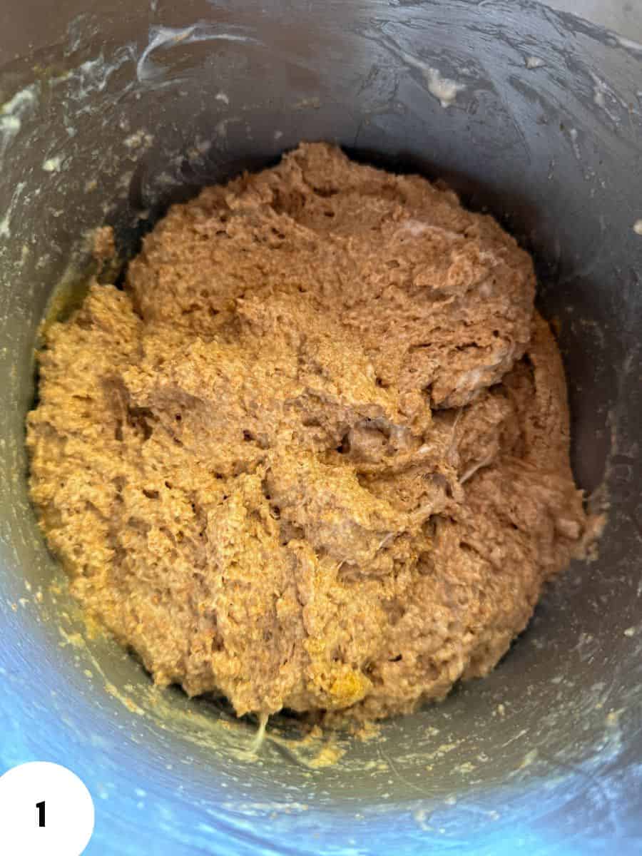 Fermented dough in a mixing bowl for bread baking process.