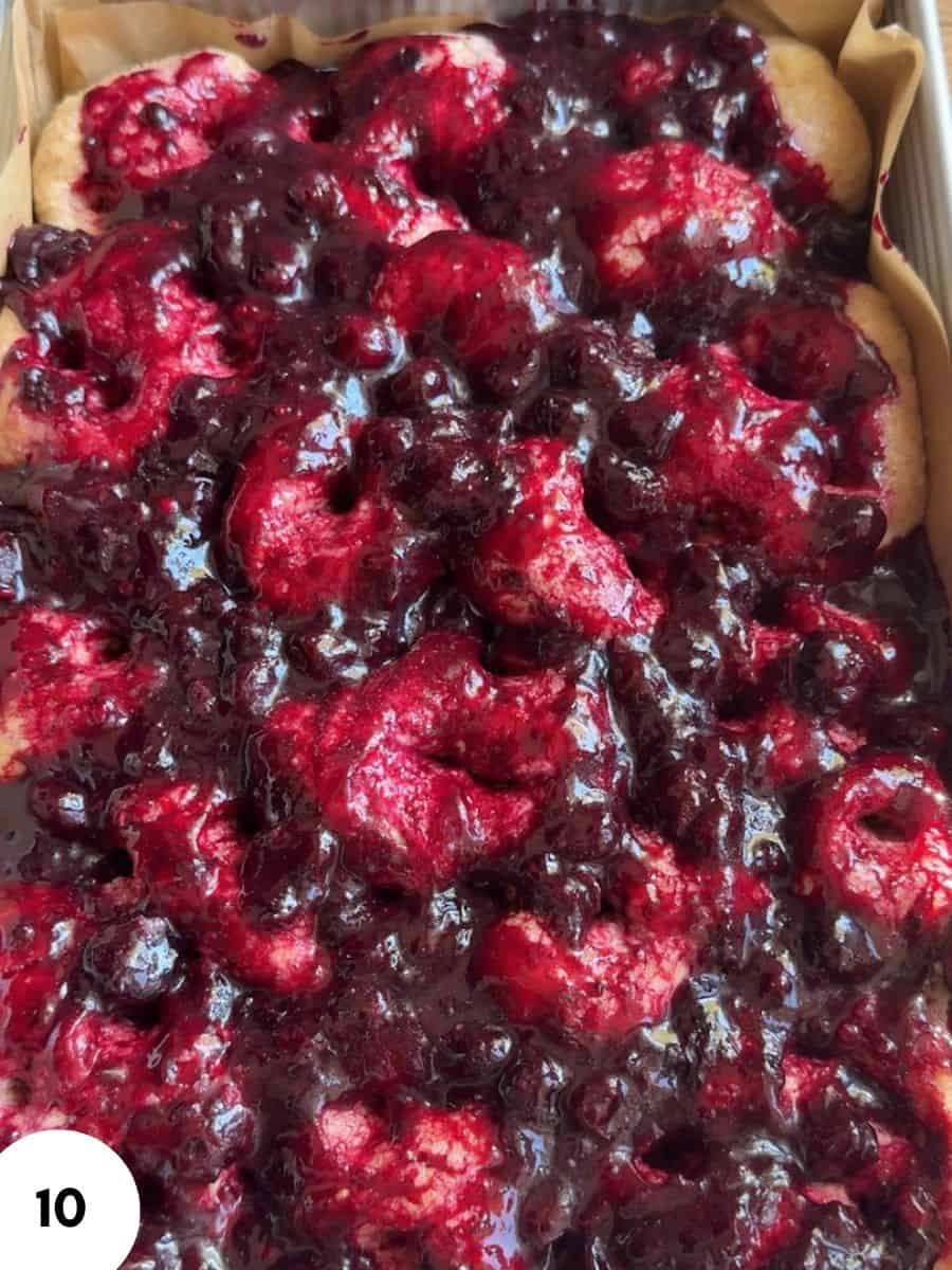 Close-up of a berry pie with raspberries and blueberries.