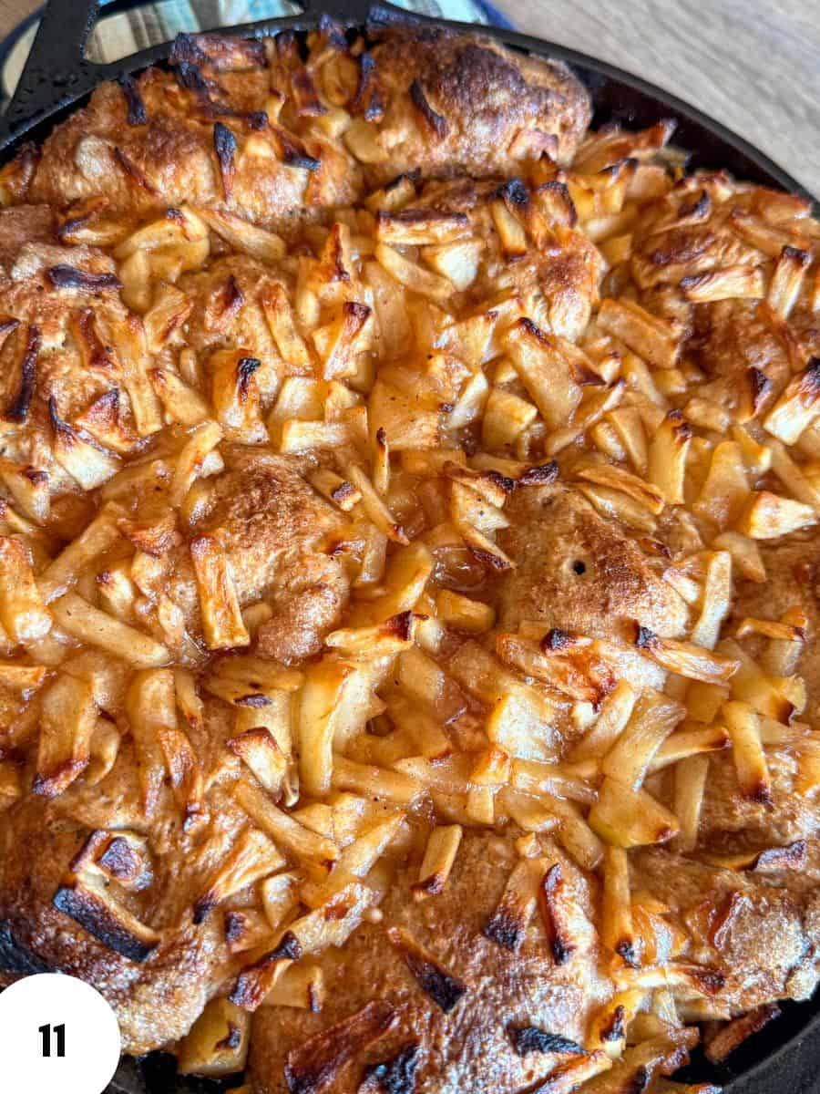 Close-up of apple pie topped with caramelized onions and baked to golden brown.