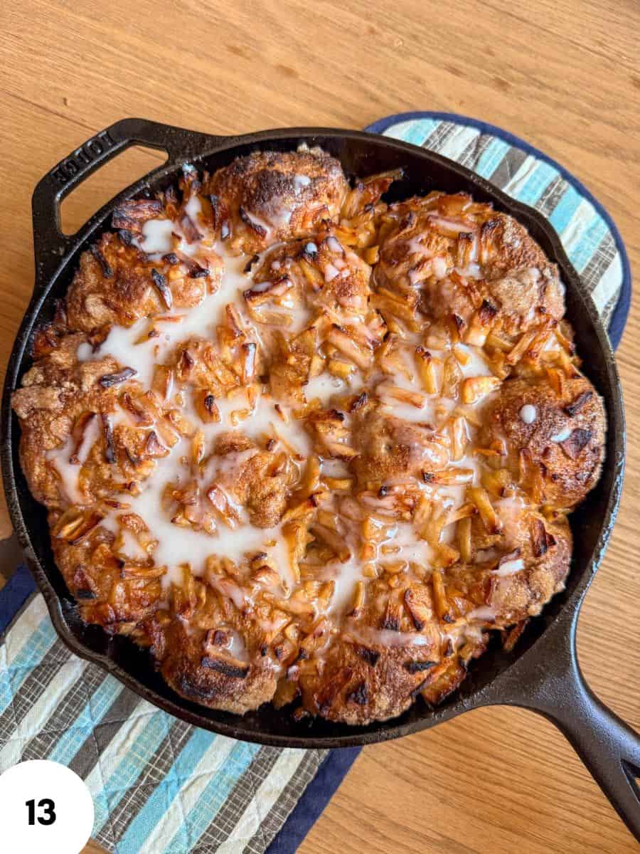 Baked chicken and pasta casserole with melted cheese in a skillet.
