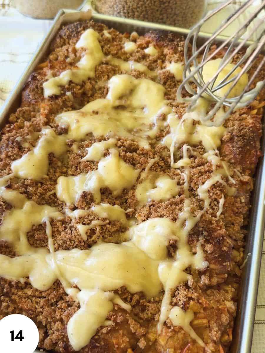 Close-up of streusel topping with melted cheese on baked dish.