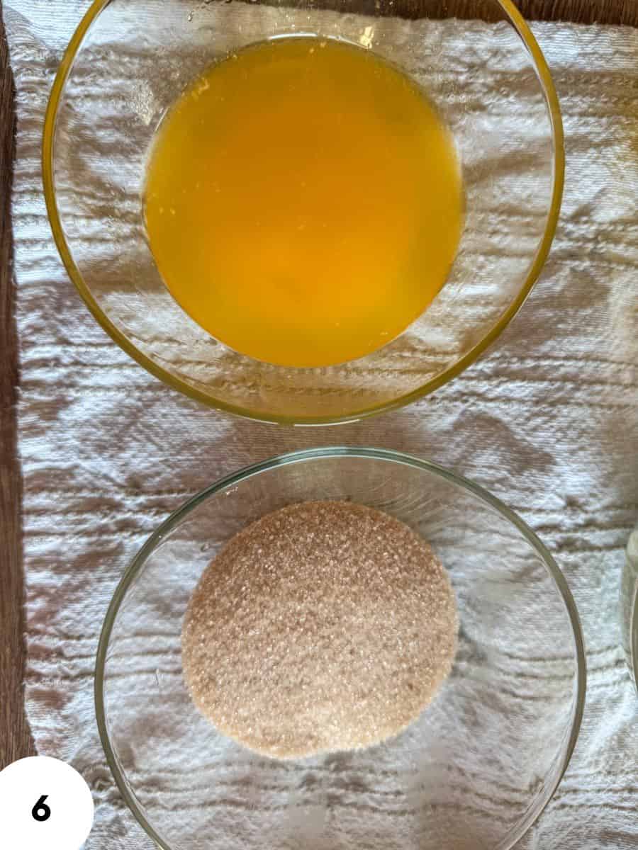 Bowl of egg wash and dough ball for bread making.