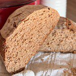 Freshly baked whole wheat bread loaf with a soft interior and crusty exterior.