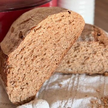 Freshly baked whole wheat bread loaf with a soft interior and crusty exterior.