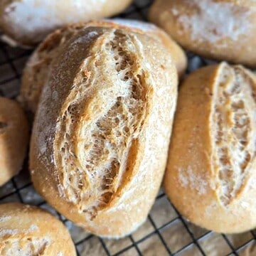 Close-up of freshly baked bread rolls with a crispy crust.
