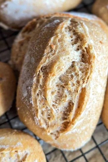 Close-up of freshly baked bread rolls with a crispy crust.