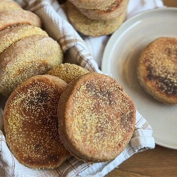 Close-up of freshly baked bread with golden crust and flour dusting.