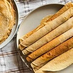 Assorted homemade wraps and flatbreads on a plate for baking and cooking.
