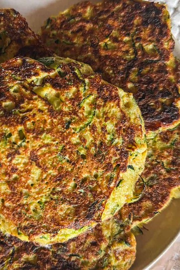 Close-up of crispy vegetable fritters on a plate.
