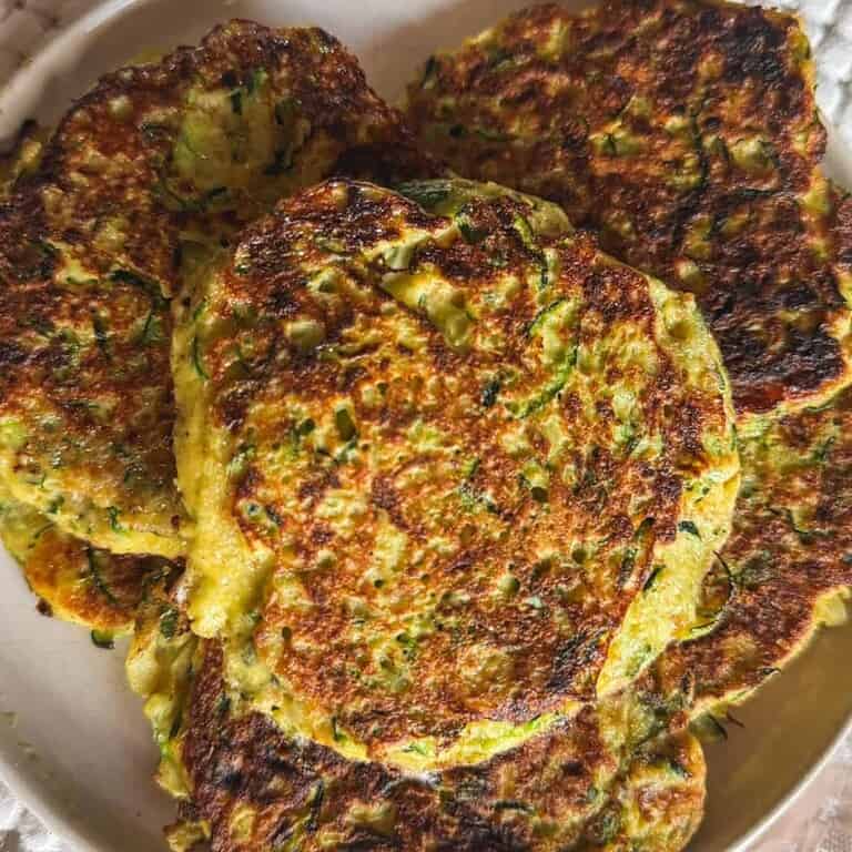 Close-up of crispy vegetable fritters on a plate.