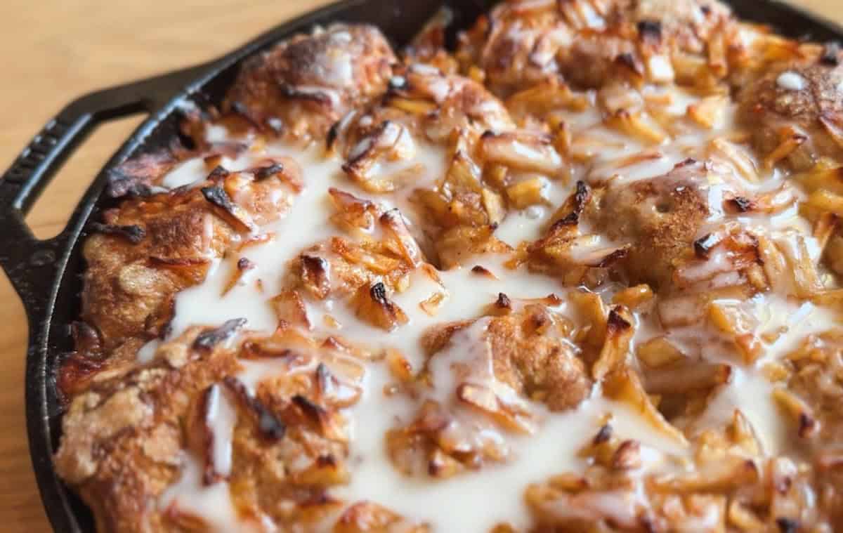 Close-up of chicken and onion pizza with melted cheese.