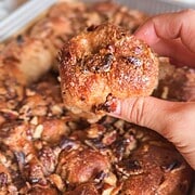 Close-up of a sticky pecan pie pull-apart sourdough focaccia piece.