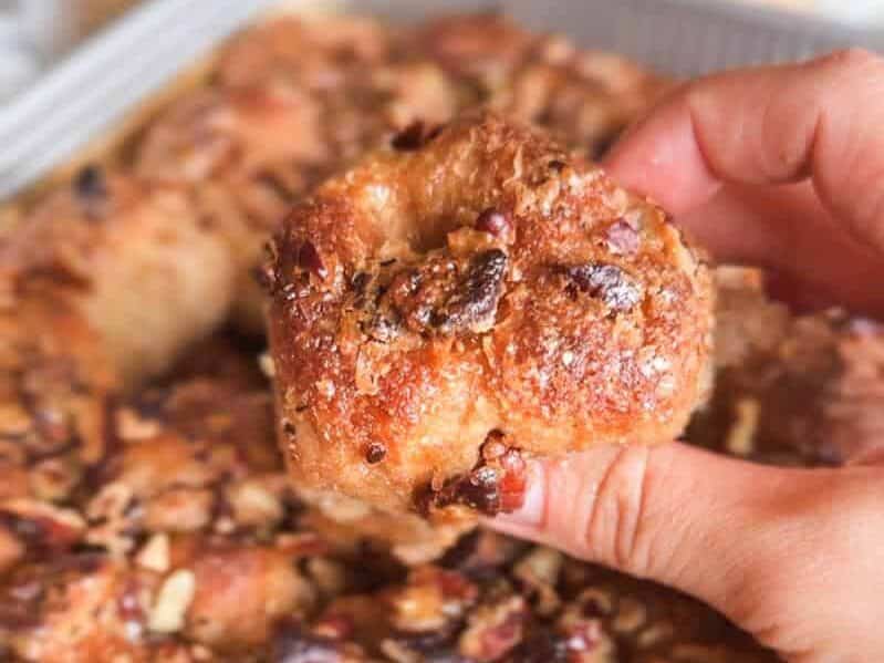 Close-up of a sticky pecan pie pull-apart sourdough focaccia piece.