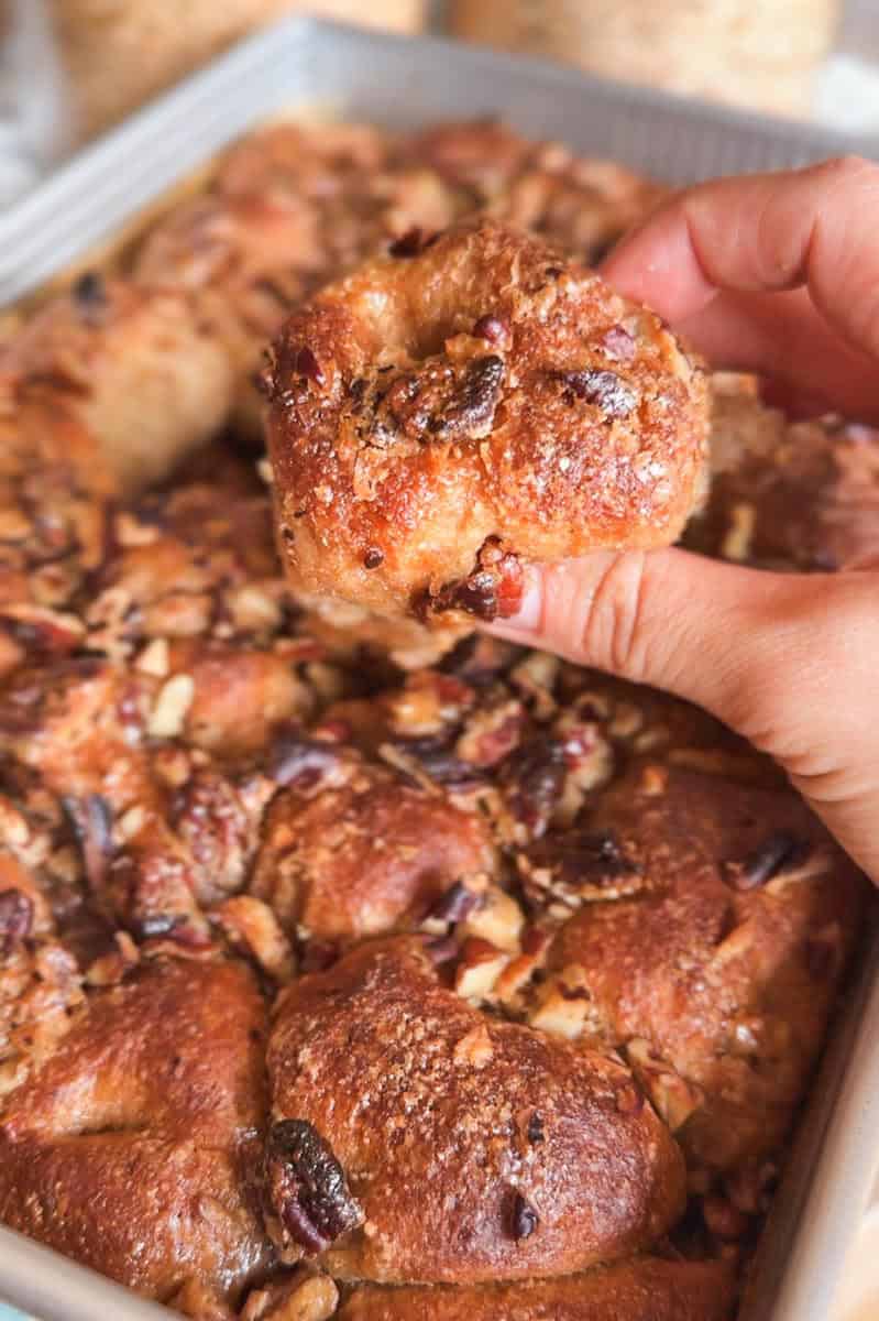 Close-up of a sticky pecan pie pull-apart sourdough focaccia piece.