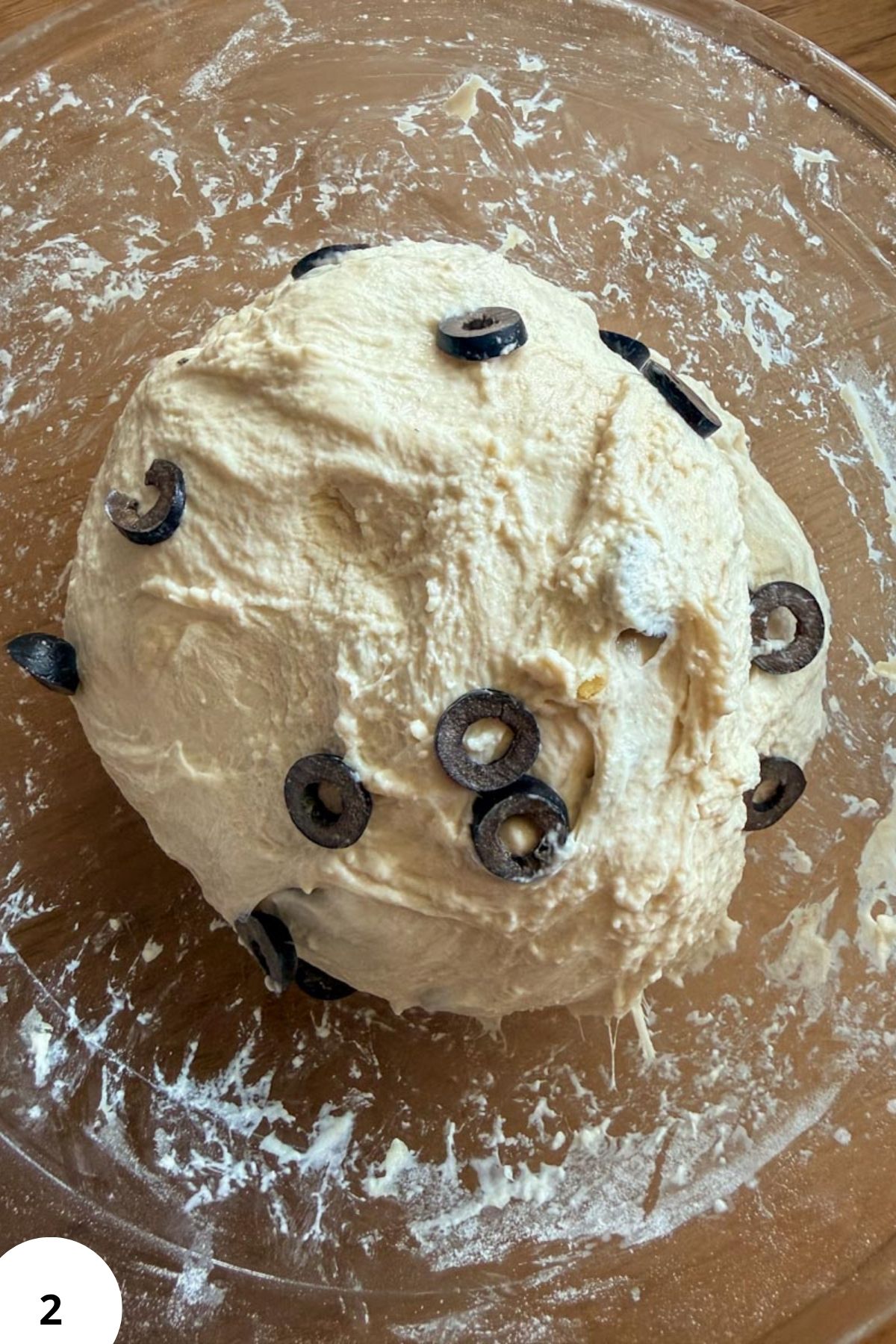 Dough with black olives for sourdough bread or focaccia.