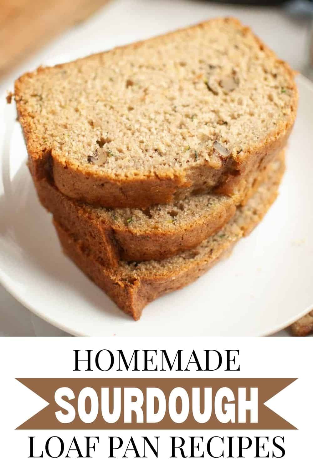 Close-up of sliced homemade sourdough bread on a white plate.