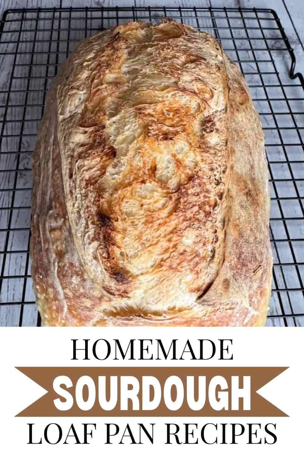 Freshly baked homemade sourdough bread loaf cooling on a wire rack.