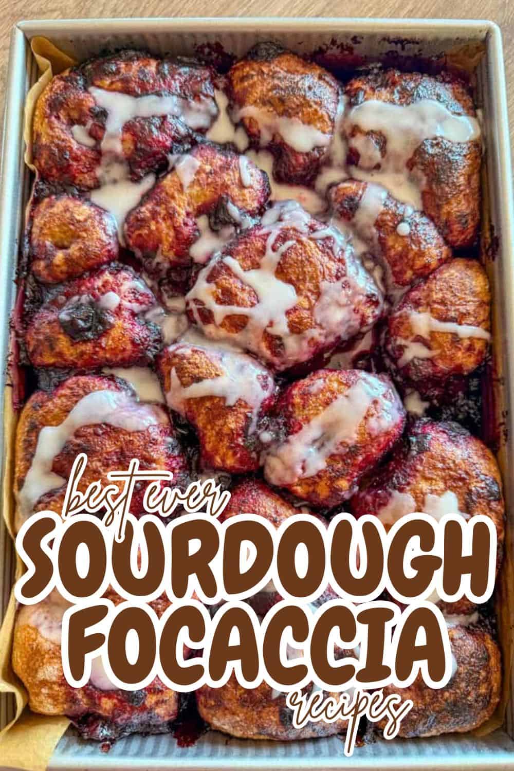 Freshly baked sourdough focaccia with toppings and drizzle.