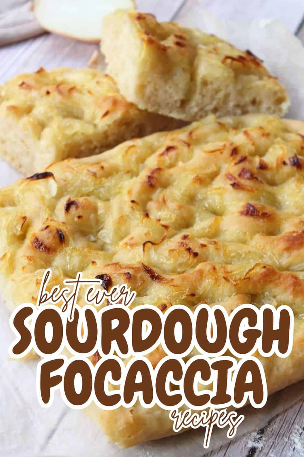 Close-up of freshly baked sourdough focaccia with cheese and herbs.
