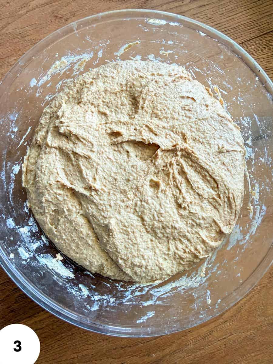 Fermentation dough in a glass bowl for bread baking.