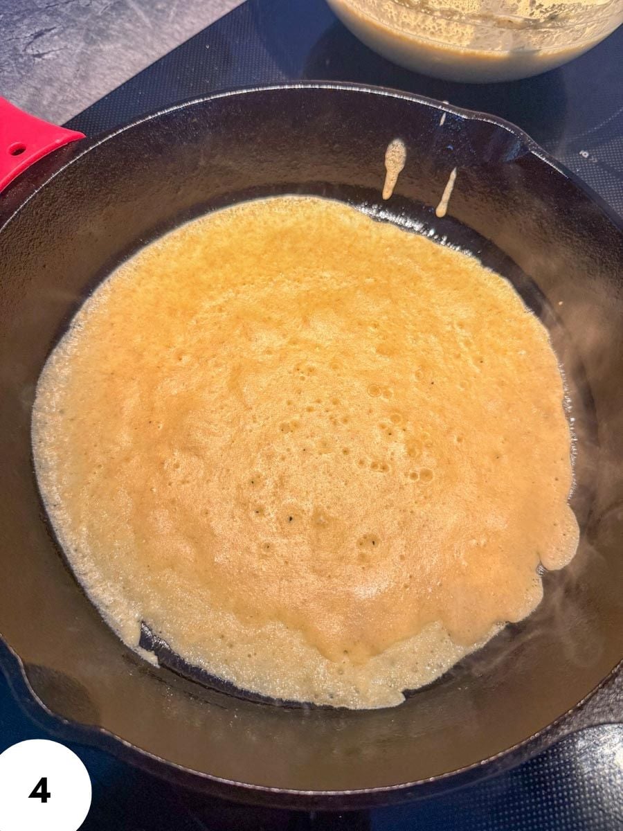 Sourdough bread dough being cooked in a skillet for baking.