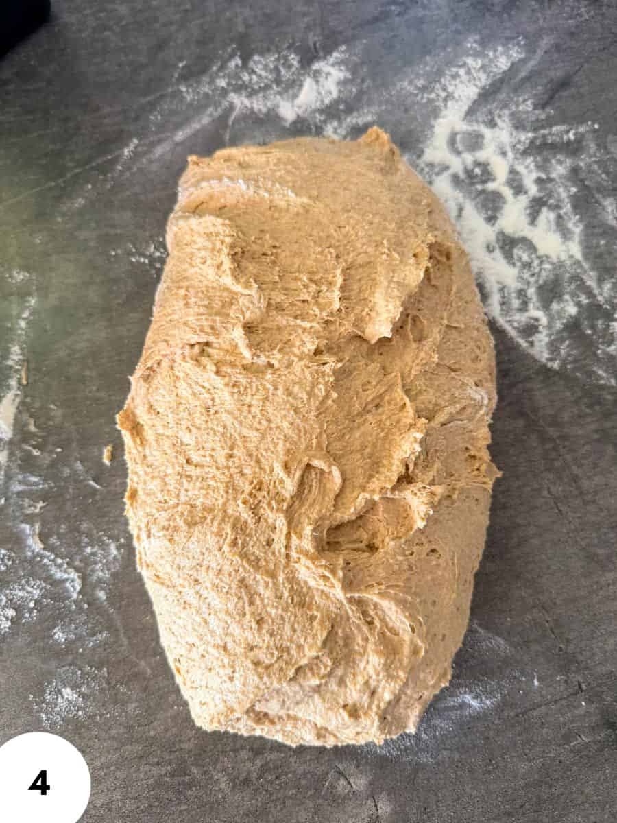 Dough for bread with stretch and fold technique on a floured surface.