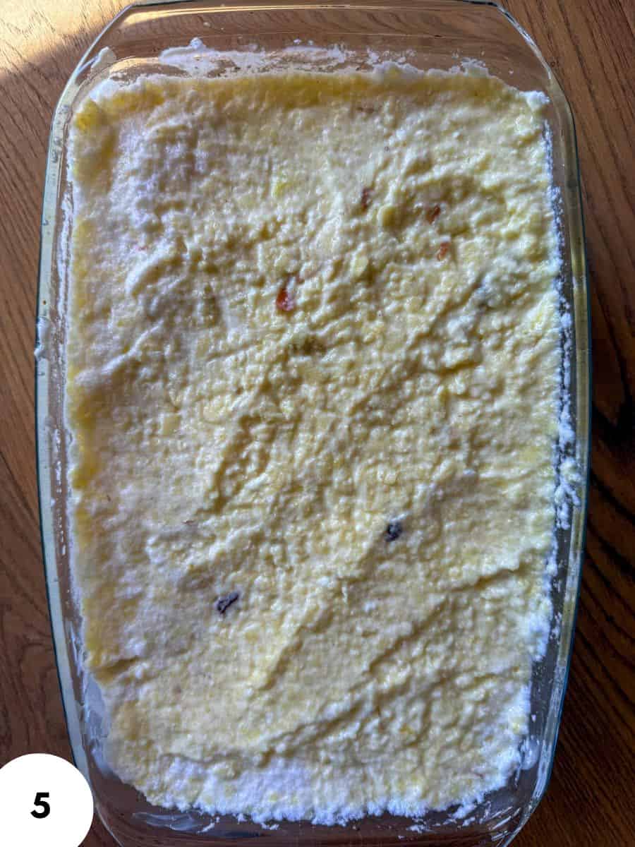 Baked apple millet and farmer's cheese casserole in glass dish.
