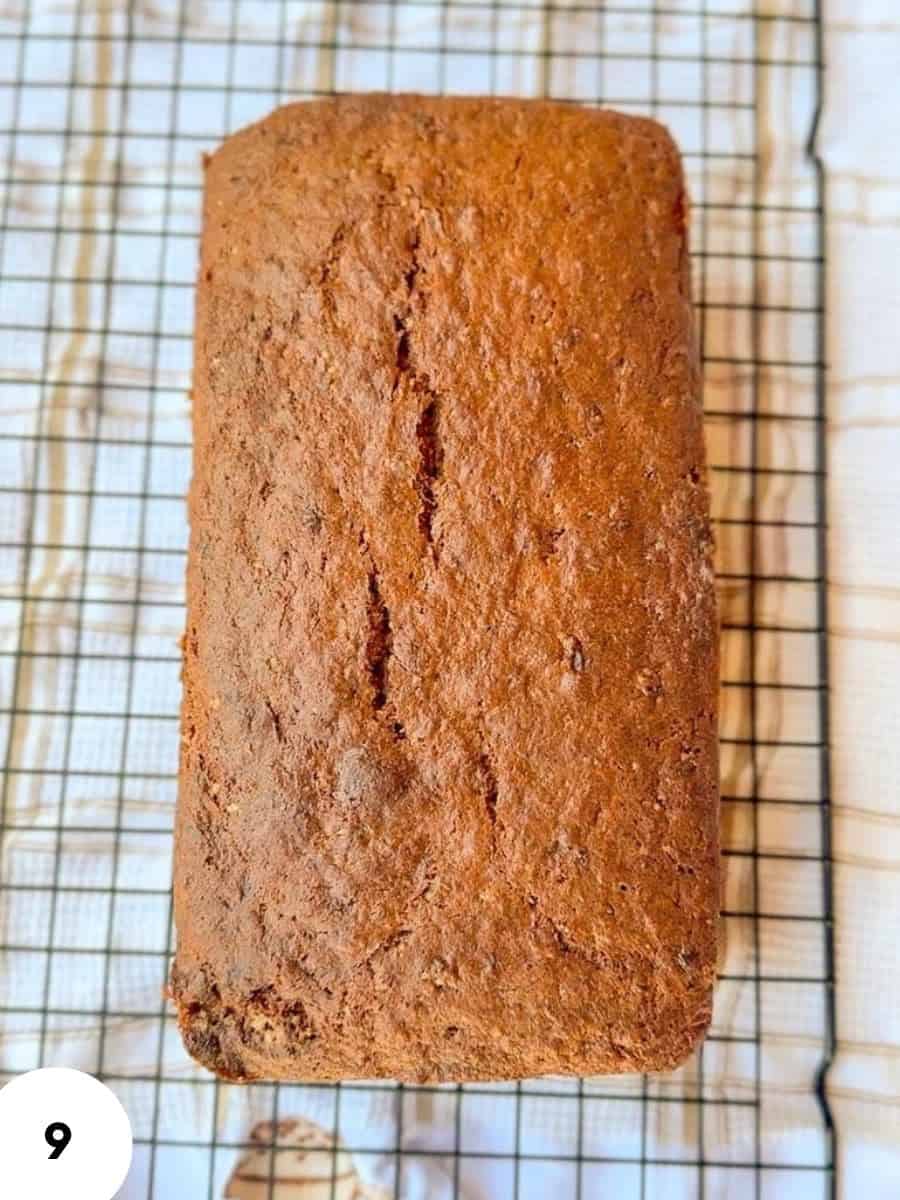 Homemade einkorn banana bread cooling on a wire rack.