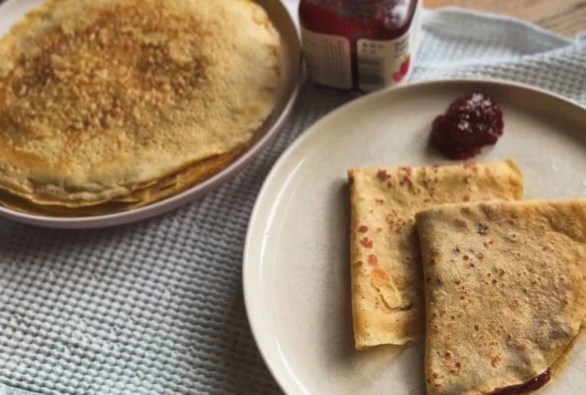 Freshly baked bread with fold technique and jam on a plate.