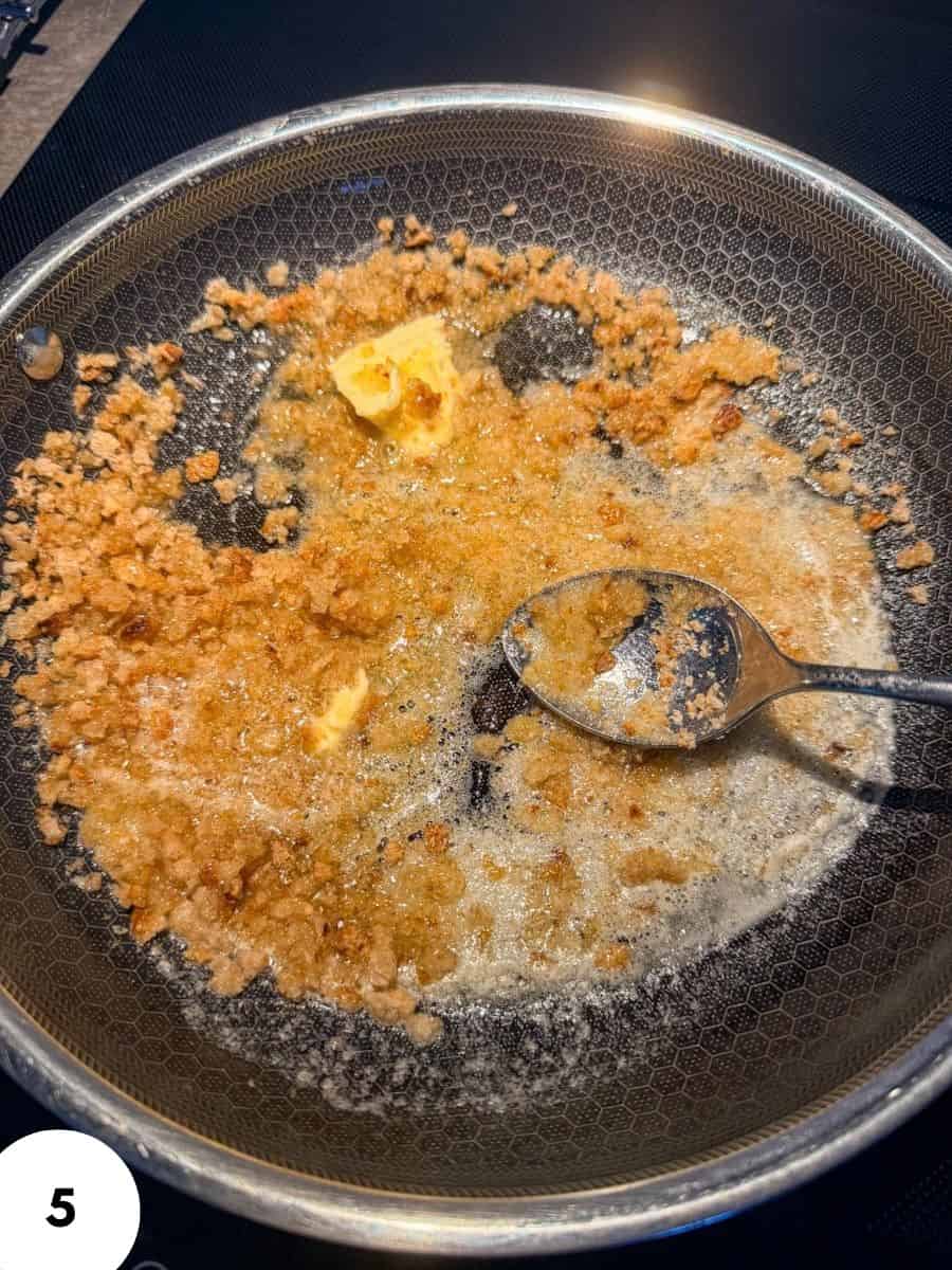 Melting butter in a non-stick pan for bread dough stretch and fold process.