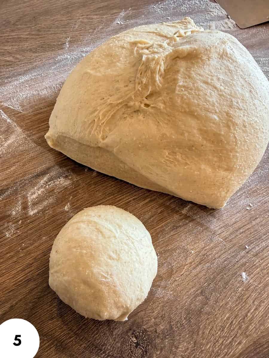 Dough ball and folded dough for bread baking on wooden surface.