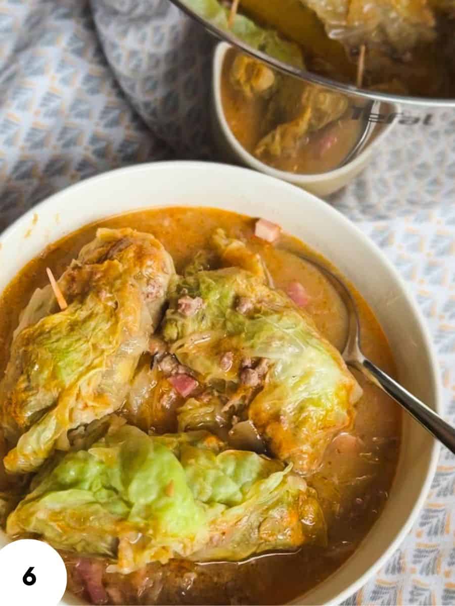 Savory stuffed cabbage rolls in tomato broth with chopped ham and herbs.