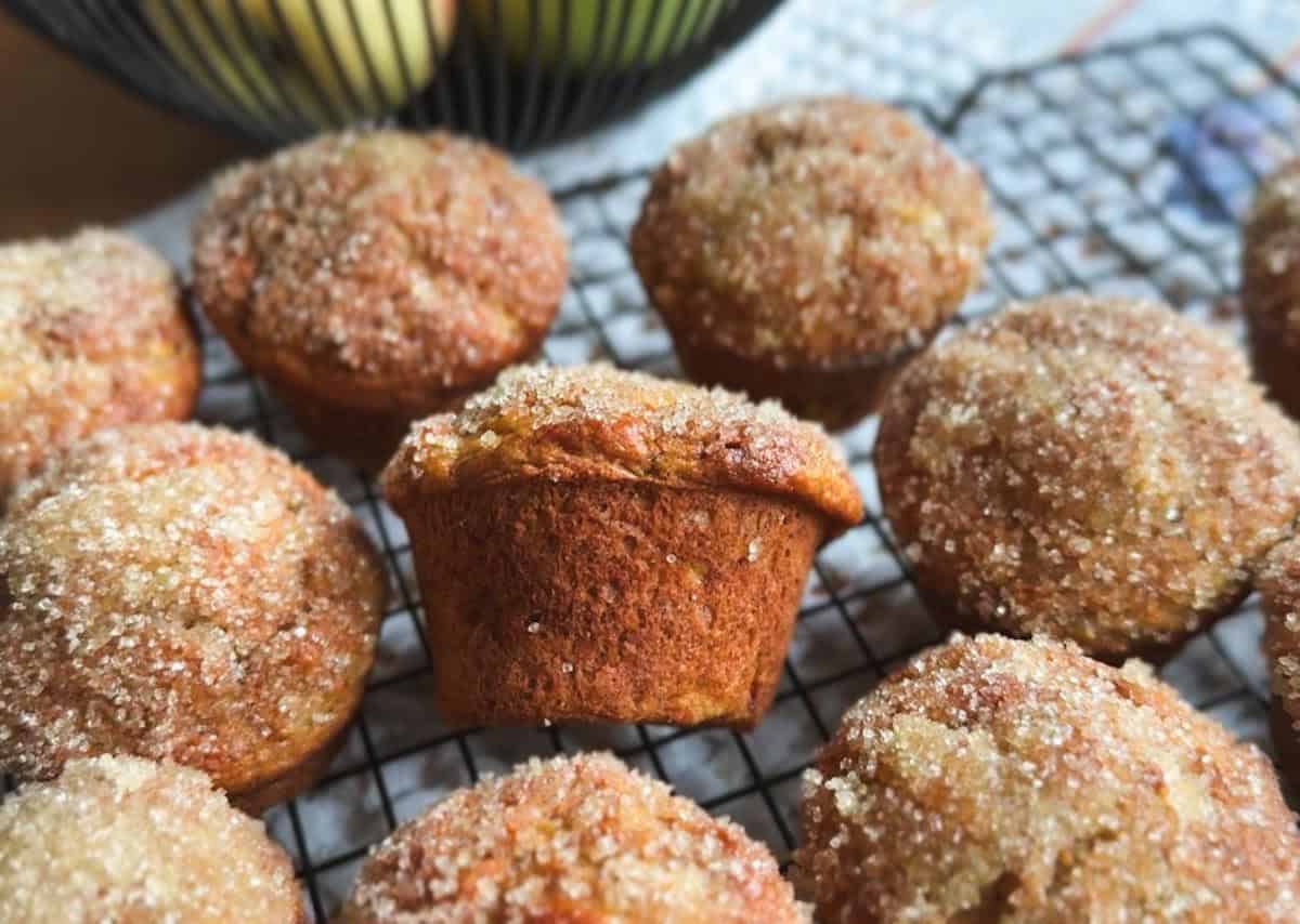 Delicious homemade muffins with sugar crust cooling on a wire rack.