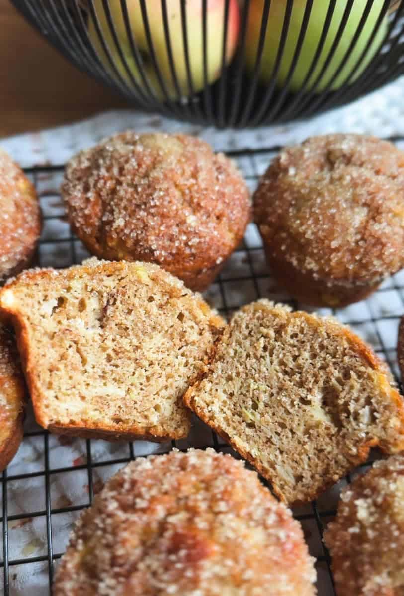 Freshly baked cinnamon sugar muffins on a cooling rack.